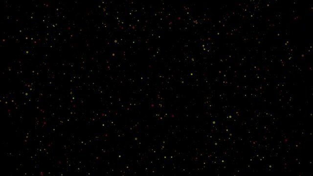 Abstract animated festive background. Flying down yellow-orange shimmering sequins sequins on a black background. 4K. Seamless loop.