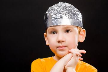 boy with a homemade cap made of aluminum foil
