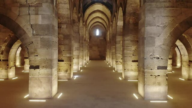 Interior of historical building with stone arches and domes.Cathedral minster church sultan Han caravanserai caravansary khan wikala funduq medieval architecture caravanserais niche courtyard detail.