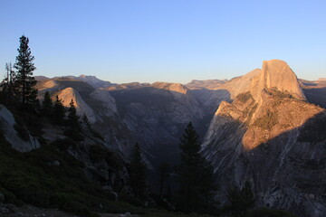 Western road trip sunset view of Half Dome from Glacier Point in Yosemite National Park, California