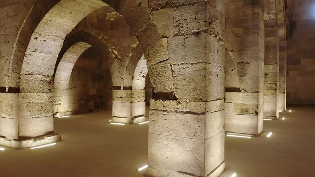 Interior of historical building with stone arches and domes.Cathedral minster church sultan Han caravanserai caravansary khan wikala funduq medieval architecture caravanserais niche courtyard detail.