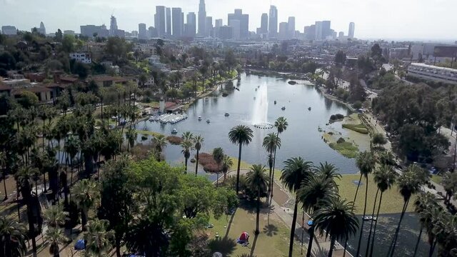 Aerial reveal of downtown Los Angeles city skyline seen from Echo Park.