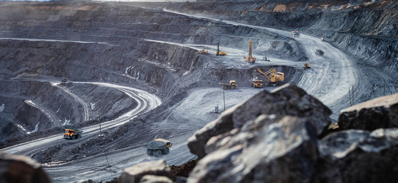 Work of heavy equipment in an open pit