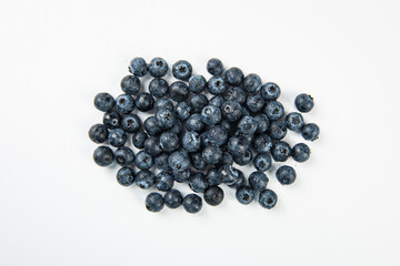 Fresh blueberry with drops of water on white background