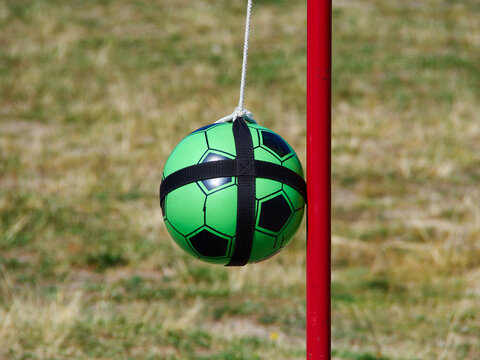 Tetherball Totem Ball attached to a red metal pole