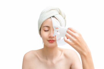 Young asian girl with naked shoulders posing on white background with facial mask, skin care concept.