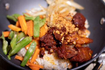 Rice with adobo chicken toppings