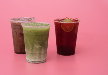 Iced green tea,iced cocoa and iced lemon tea on pink background