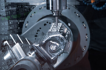 Modern industry high precision CNC milling machine cutting engine part. CNC programming code. Industrial metalworking manufacturing.   © Itsanan
