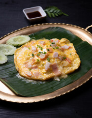 Creamy omelette with shrimps on the table