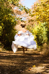 bride running in woods