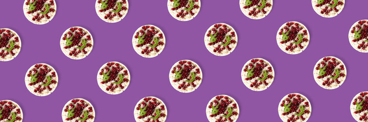 Abstract background from galett. Healthy breakfast with rice cake and pomegranate on black flat lay. Pop art