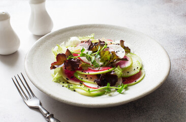 Purple and white radish and mixed salad leaves fresh salad close up