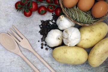 Fototapeta na wymiar Fresh food from the garden accompanied by wooden cutlery