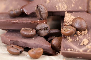  chocolate bar with cocoa powder topping and coffee beans © rsooll