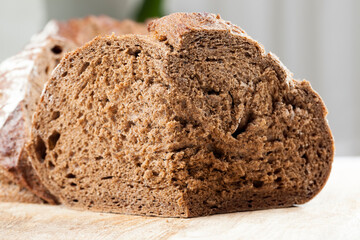 delicious fresh loaf of bread, black rye bread with a crisp