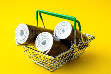 Linoleum in a shopping basket. Linoleum purchased. Basket with linoleum.