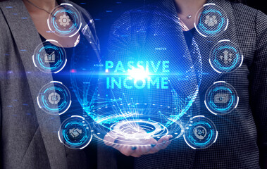 Business, Technology, Internet and network concept. Young businessman working on a virtual screen of the future and sees the inscription: Passive income