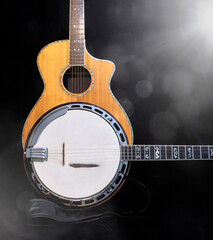 Banjo and Acoustic guitar for country and bluegrass music with a black and white lens glare