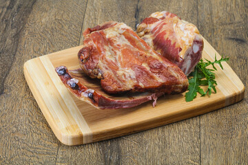 Smoked pork ribs over the wooden background