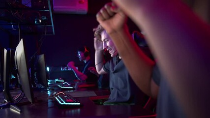 The last seconds of the last game in the strategy esports multi-race team championship, the guys celebrate the victory