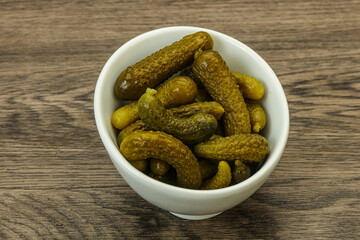 Pickled gherkin in the bowl