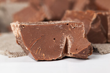 divided into pieces a piece of chocolate from cocoa