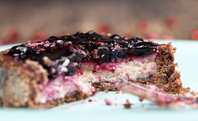round tartlet with strawberries and blueberries in butter cream