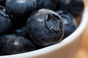 fresh ripe blueberries in a glass bowl