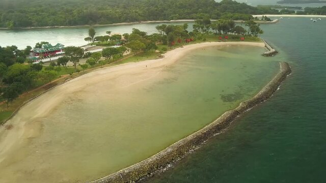 Drone shot of Kusu island with dark clouds, Singapore