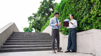 business people talking during break discussing new project business outside office in the city