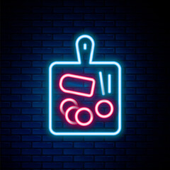 Glowing neon line Cutting board icon isolated on brick wall background. Chopping Board symbol. Colorful outline concept. Vector