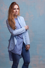 young beautiful Caucasian woman, on a blue background.