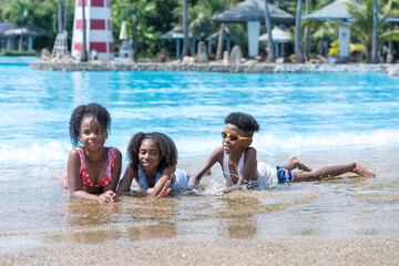 Fototapeta na wymiar Children playing in the water park. Children in holiday.