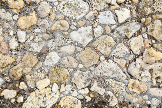 small stones filled with cement. Stone texture. Top view