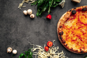 Top view on neopolitan fresh baked margherita pizza on the grey background