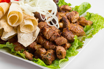 Isolated assorted caucasian shashlyq skewers platter