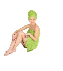 Spa Girl. Beautiful Young Woman After Bath with green towel. isolated on white