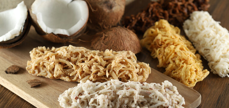 Cocada, coconut candy. Composition on wooden background