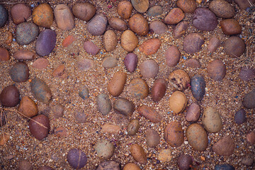 Stones and sand decorate the walkway in the park