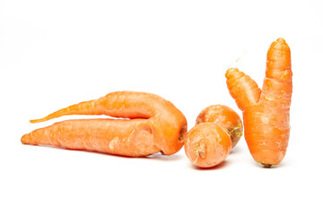 Fresh natural ugly raw carrot isolated on white background