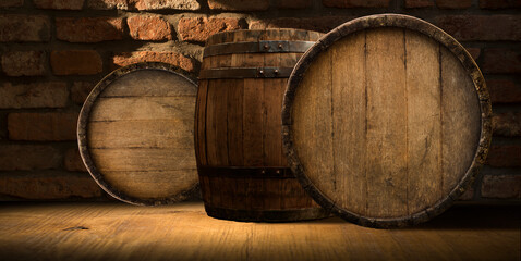 A wine cellar full of barrels of wine