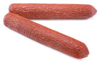 Stick of raw smoked sausage close-up. Isolated on a white background.