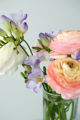 Beautiful bouquet with spring ranunculus and freesias