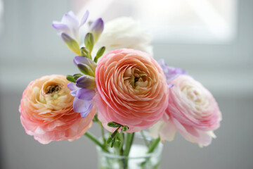 Beautiful bouquet with spring ranunculus and freesias