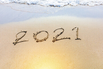 Happy New Year 2021 is coming concept sandy tropical ocean beach lettering