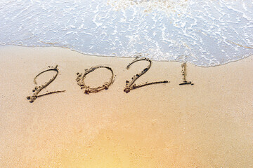 Happy New Year 2021 is coming concept sandy tropical ocean beach lettering