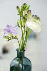 Beautiful bouquet with spring ranunculus and freesias