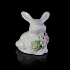 Fototapeta na wymiar porcelain figurine of a rabbit. easter white bunny. antique figurine