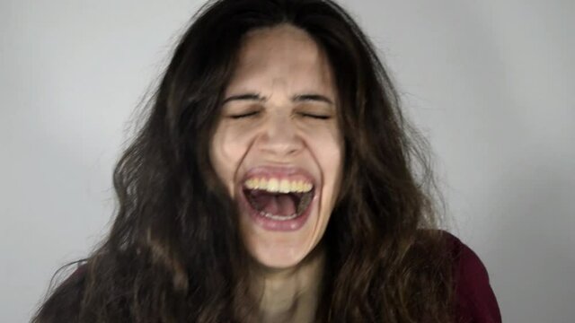 Young psychotic woman laughs uncontrollably